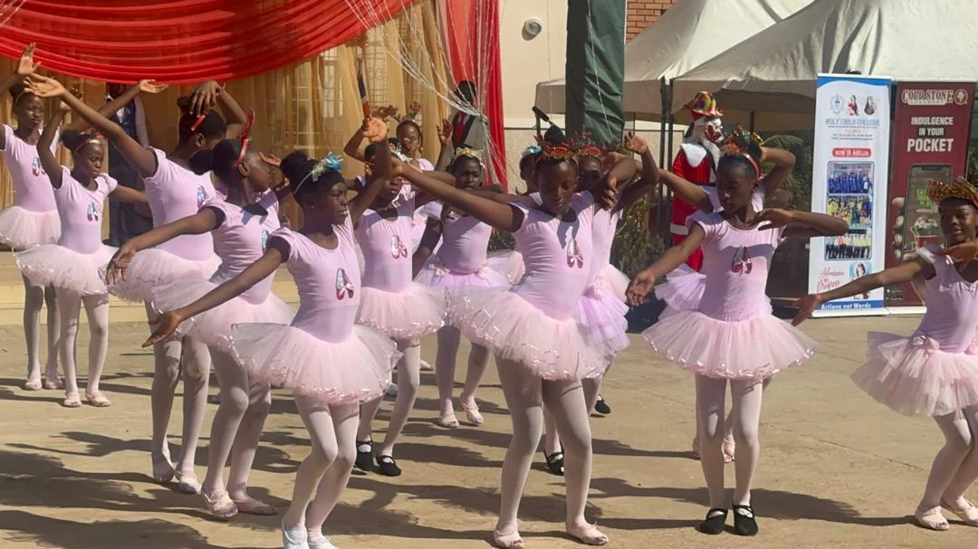 Students performing ballet at Holy Child College event