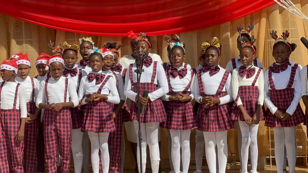 Students performing at Christmas carol event